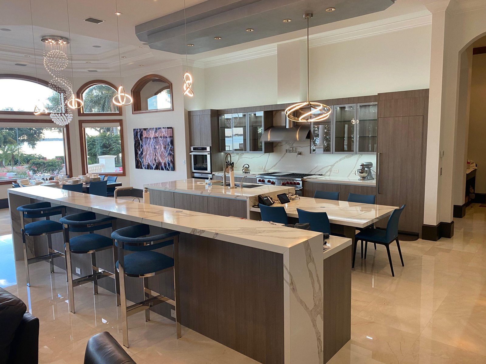 Open-concept luxury kitchen island marble wood ARMADI custom cabinetry